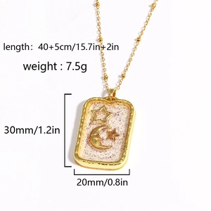 Gold celestial necklace with sun and moon pendant in purple resin including size specs