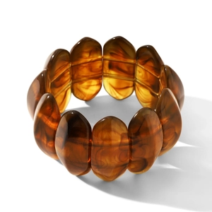 Detailed macro view of the amber resin beaded bracelet with marble texture