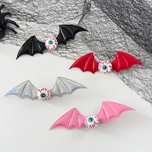 Halloween bat wing hair clips with eyeballs in black, red, silver, and pink colors