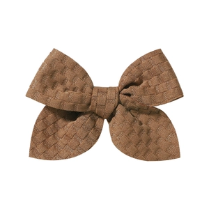 Macro shot of 3.3-inch brown jacquard knitted bow hair clip with checkered texture