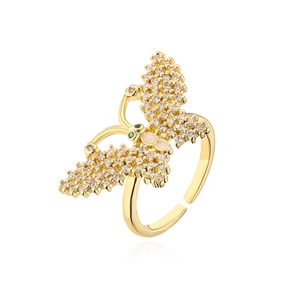 Macro detail of 18K gold plated butterfly ring featuring white cubic zirconia stones