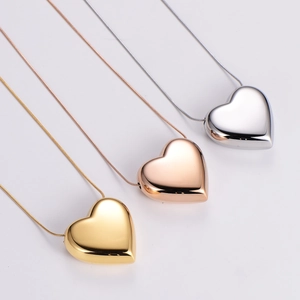 3D heart pendant necklace set in gold, rose gold, and silver finishes with snake chain