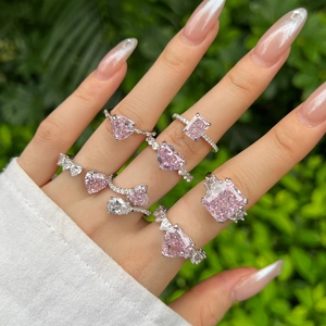 Close-up of S925 silver rings with pink heart and pear-shaped high carbon diamonds