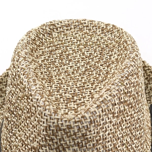 Macro shot of tight woven natural fiber texture on a Panama style straw hat crown