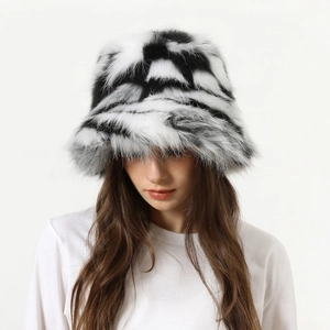 Close-up of black and white zebra print faux fur bucket hat with soft plush texture