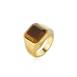 Macro shot of men's gold plated signet ring with a polished rectangular tiger eye stone