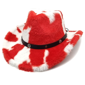 Detail of red and white cow print plush cowboy hat with metal floral studs on a black band