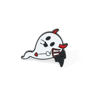 Close-up of cute Halloween ghost enamel pin with detailed metal edges and vibrant colors