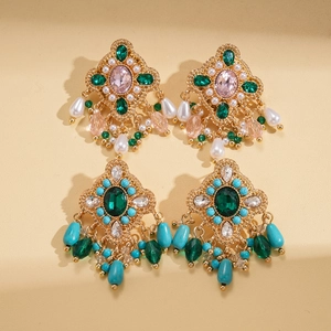 Vintage bohemian drop earrings with emerald crystals, water-drop tassels and gold-plated details