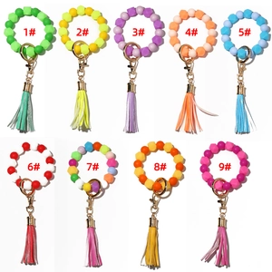 Luminous silicone bead wristlet keychains in multiple vibrant colors with leather tassels