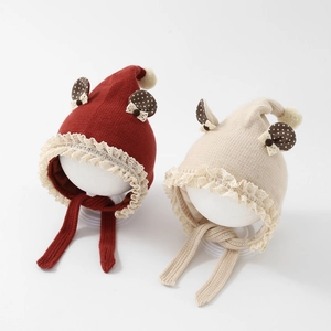 Knitted baby hats with lace trim and polka dot ears in dark red and beige cream colors