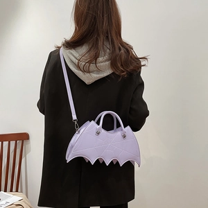 Detailed back view of a purple bat-shaped PU shoulder bag with spider web embroidery