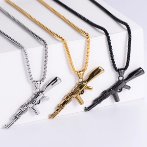 AK47 rifle pendant necklace in gold silver and black steel finish on minimalist stand