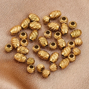 Golden stainless steel wheel beads with diagonal textures for DIY jewelry making