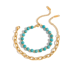 Detail of turquoise bead strand and gold metal thick chain with lobster clasp closures