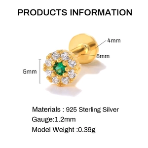 Detail view of 925 sterling silver gold flower stud with green zircon and 5mm diameter