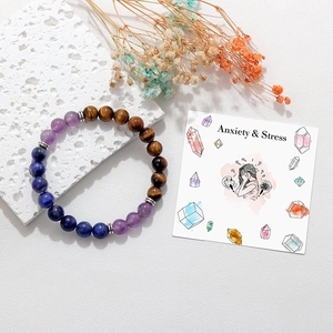Tiger eye and amethyst 8mm beaded yoga bracelet for anxiety relief on stone background