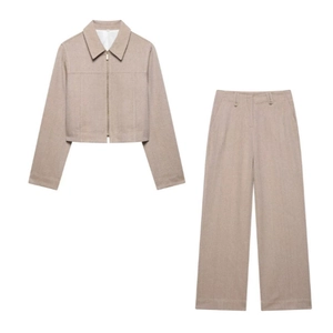 Dames tweed set met kort jasje met rits en wijde broek in visgraatmotief, beige melange
