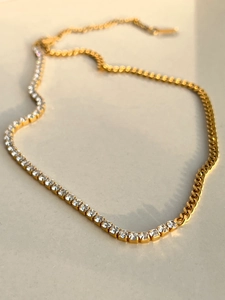Detail of 18K gold plated curb chain merged with a sparkling zircon tennis necklace