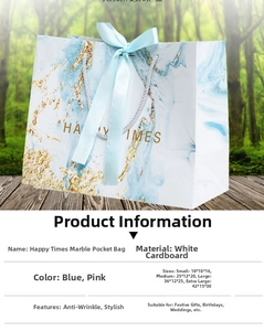 Marble pattern gift bags with ribbons in various sizes for stylish boutique packaging
