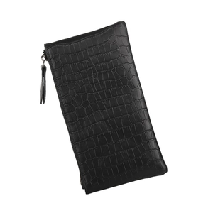 Detail of long black wallet with faux crocodile texture, side zipper and handle