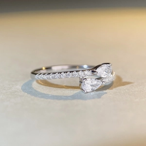 Elegant S925 sterling silver bypass ring featuring two pear-shaped drop diamonds