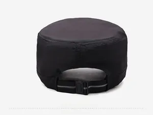 Detail of adjustable back strap with plastic buckle on a black quick-dry military cap