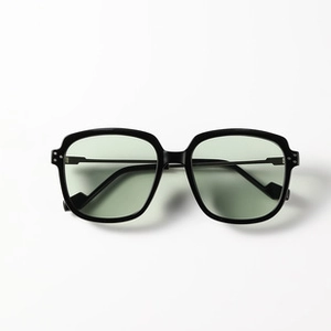 Close-up of folding square sunglasses featuring black frames and light green lenses