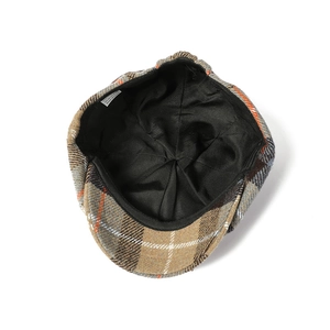 Detailed interior view of checkered newsboy cap showing black lining and craftsmanship