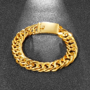 Detail shot of a bold gold-plated stainless steel Cuban link bracelet for men