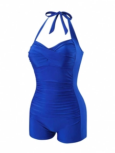Detail of royal blue lace-up one-piece swimsuit with flattering ruching and boyleg cut