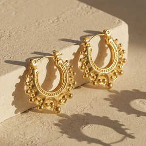 U-shaped gold stainless steel earrings with crown-inspired bead edge and vintage design