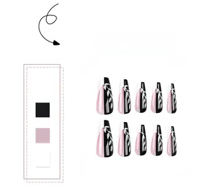Detail of pink and black coffin press-on nails with white leaf patterns in a 10-piece set