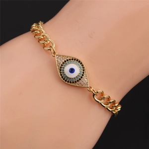 Gold plated Turkish Evil Eye bracelet with sparkling blue zircon inlay on a Cuban chain link