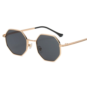 Classic octagonal gold metal frame sunglasses with dark lenses and vintage polygon style