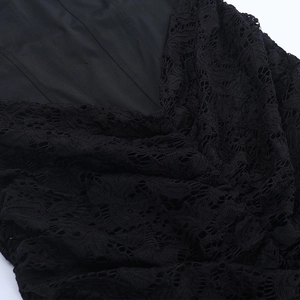 Close-up of intricate black floral lace pattern and high-quality lining stitching detail