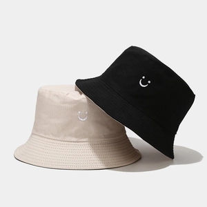 Detail of high-density cotton bucket hats with smile embroidery and five-row brim stitching