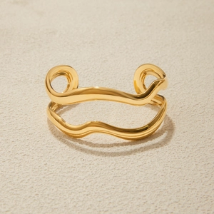 Detailed view of 18K gold plated stainless steel double-layer wavy open bangle bracelet
