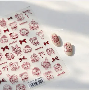 Detail of cute hand-drawn animal nail stickers with red bows and bear patterns