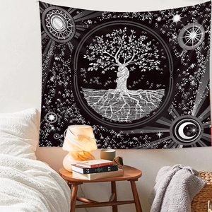Bohemian Tree of Life tapestry with sun and moon stars hanging in a cozy bedroom