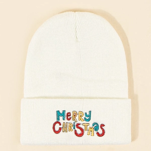 Close-up of colorful Merry Christmas embroidery on white knit beanie texture