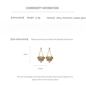 Detailed view of bohemian teardrop earrings with dimensions 5cm x 2.5cm and silver pins