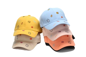 Detailed view of colorful cartoon animal embroidery on kids cotton baseball hats