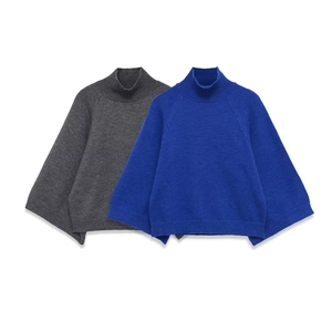 Detail of knit texture on dark grey and royal blue sweaters with mock neck design
