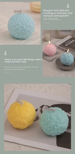Detailed relief of rose petals on colorful spherical scented candles in various pastel tones