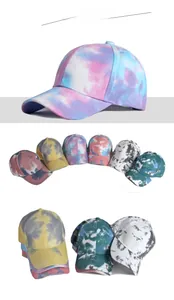 Detail view of cotton tie-dye baseball caps in six vibrant colors with soft textures