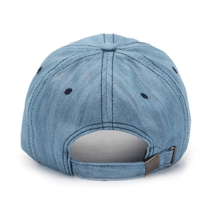 Rear view of washed blue denim baseball cap featuring adjustable metal buckle and stitching