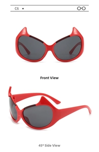 Detail view of red devil horn sunglasses with dark grey lenses in front and side angles