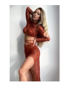 Macro detail of sheer mesh fabric with marble print and side slit on bikini cover-up skirt