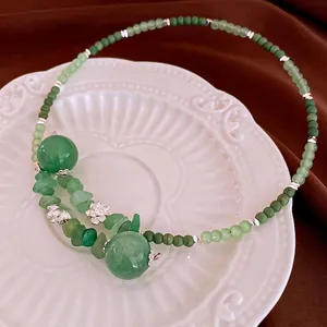 Elegant Neo-Chinese necklace with green beaded jade stones and silver lotus charms